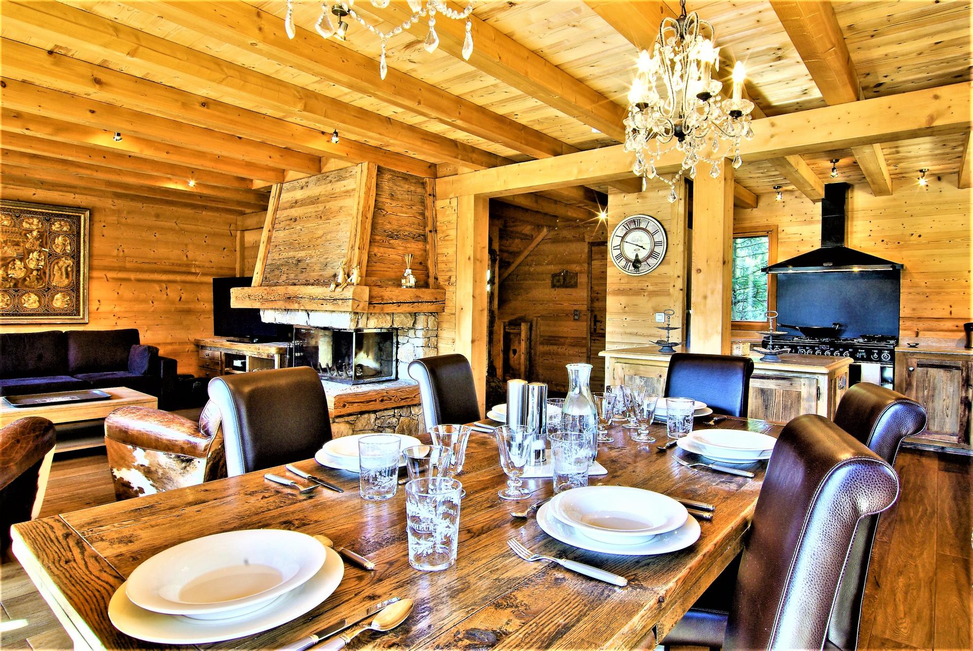 THE KITCHEN OPENS ON TO THE DINING AREA IN CHALET DES BOIS