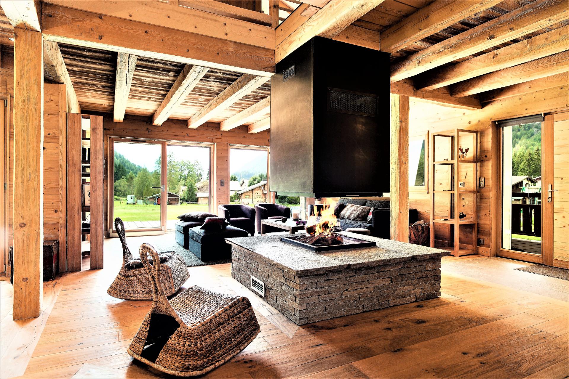 THE FIREPLACE AND THE LOUNGE IN CHALET DES GRANDS MONTETS